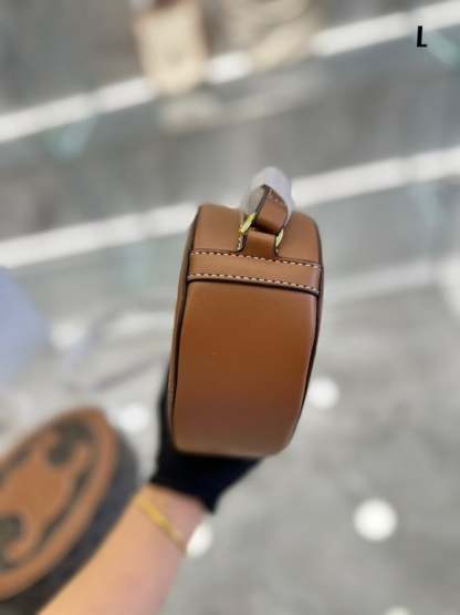 CE OVAL BAG CUIR TRIOMPHE IN TEXTILE AND CALFSKIN NATURAL 20CM