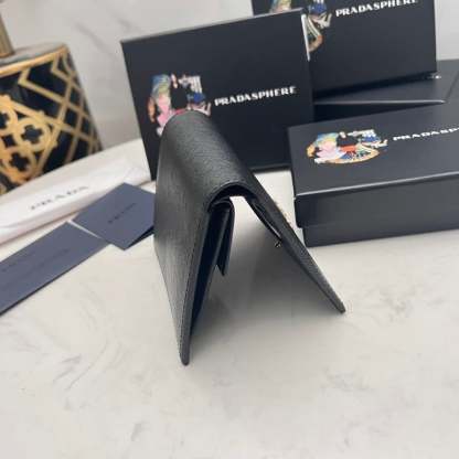PR SMALL SAFFIANO LUX LEATHER FLAP CONTINENTAL TRIANGLE BLACK WALLET 10CM