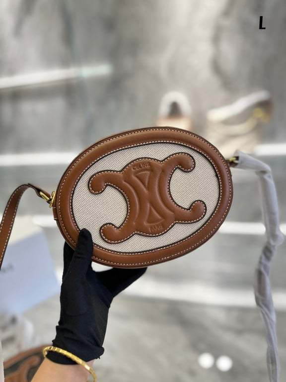 CE OVAL BAG CUIR TRIOMPHE IN TEXTILE AND CALFSKIN NATURAL 20CM