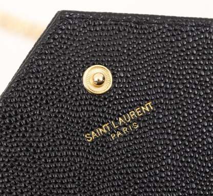 SAINT LAURENT CASSANDRE MATELASSE CHAIN WALLET IN GRAIN DE POUDRE EMBOSSED BLACK GOLD 22CM