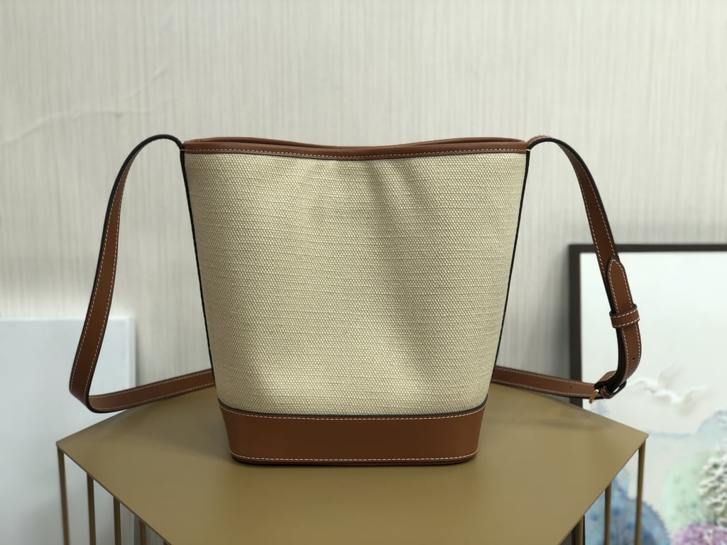 CE CUIR TRIOMPHE IN TEXTILE AND CALFSKIN NATURAL TAN BAG BUCKET