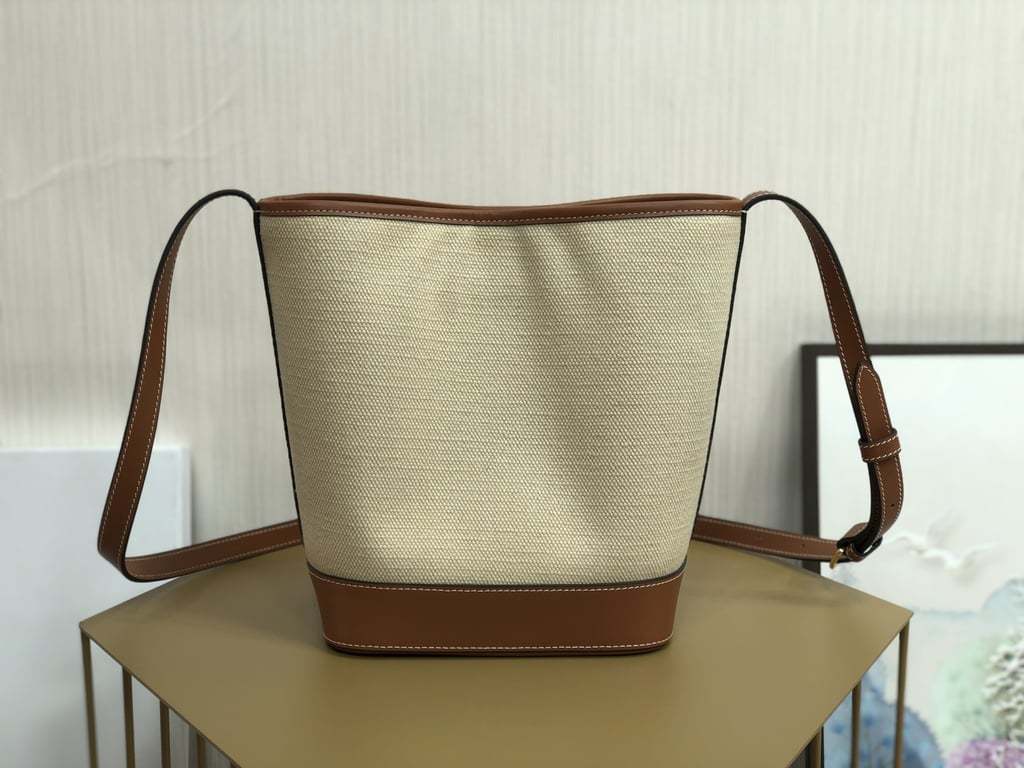 CE CUIR TRIOMPHE IN TEXTILE AND CALFSKIN NATURAL TAN BAG BUCKET