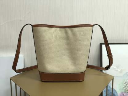 CE CUIR TRIOMPHE IN TEXTILE AND CALFSKIN NATURAL TAN BAG BUCKET