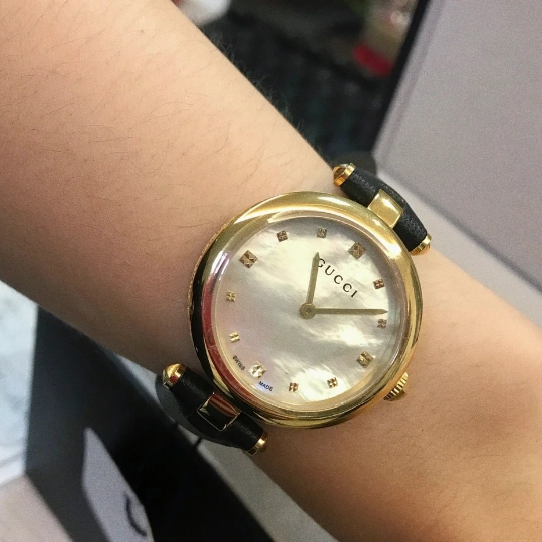 GUCCI DIAMANTISSIMA SWISS QUARTZ WITH BLACK STRAP AND GOLD TONE 27MM YA141404