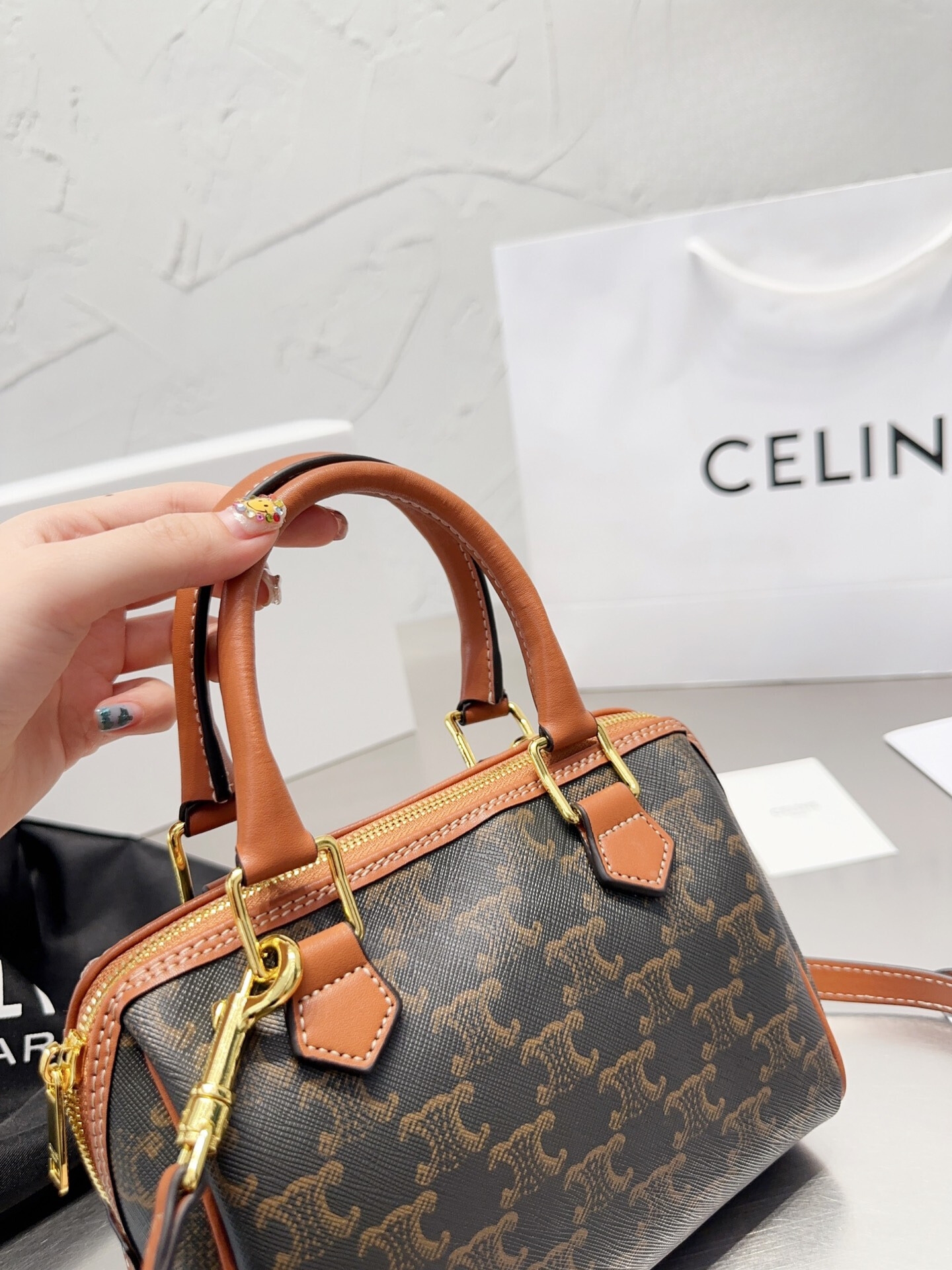 CE SMALL BOSTON IN TRIOMPHE CANVAS AND CALFSKIN TAN 19CM 113772CAS04LU