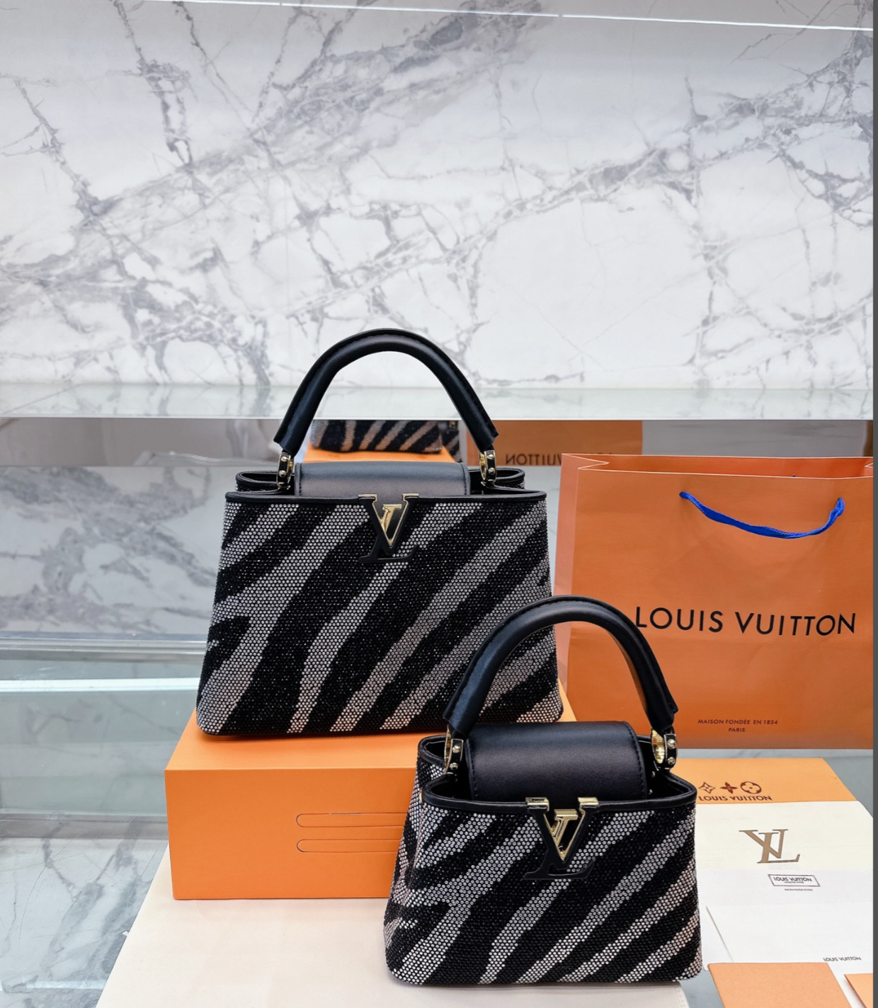 LV CAPUCINES MM BLACK AND GREY ZEBRA PATTERN 27CM M58517
