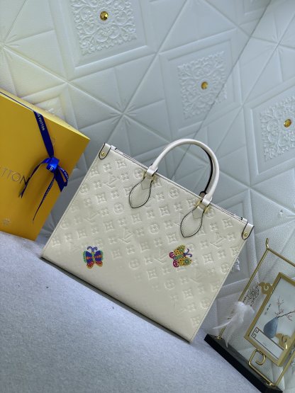 LV x YK ON THE GO MM WITH FLOWER MARQUETRY IN QUARTZ 35CM M21732