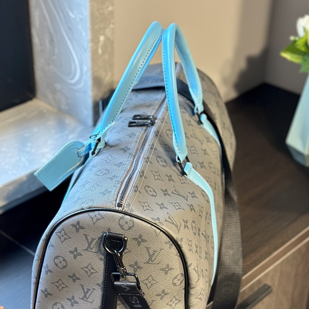 LV KEEPALL BANDOULIÈRE 45 MONOGRAM ECLIPSE REVERSE COATED CANVAS TURQUOISE 45CM M11481