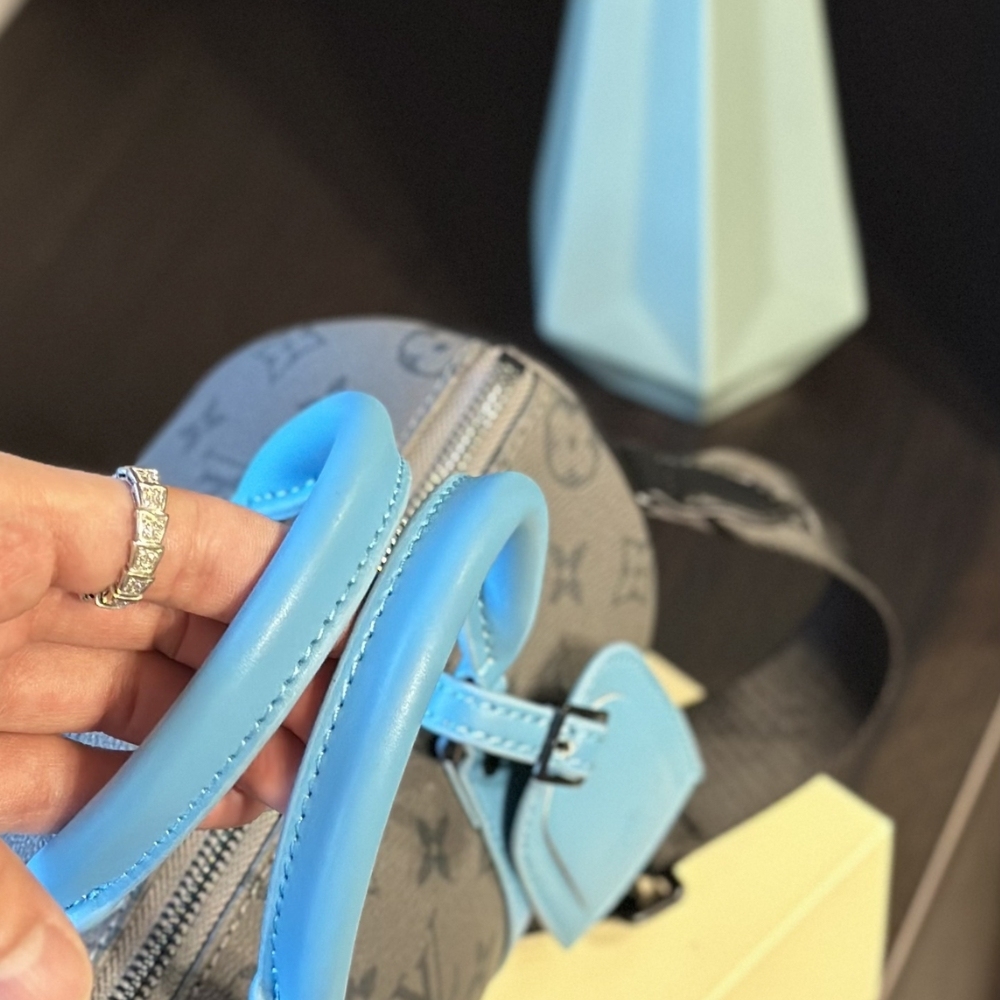 LV KEEPALL BANDOULIÈRE 25 MONOGRAM ECLIPSE REVERSE COATED CANVAS TURQUOISE 25CM M11645