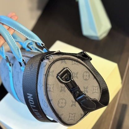 LV KEEPALL BANDOULIÈRE 25 MONOGRAM ECLIPSE REVERSE COATED CANVAS TURQUOISE 25CM M11645