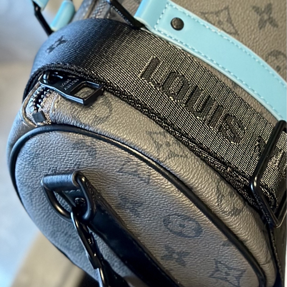 LV KEEPALL BANDOULIÈRE 25 MONOGRAM ECLIPSE REVERSE COATED CANVAS TURQUOISE 25CM M11645