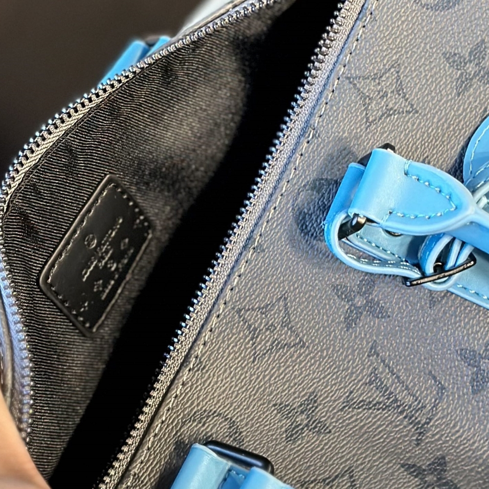 LV KEEPALL BANDOULIÈRE 25 MONOGRAM ECLIPSE REVERSE COATED CANVAS TURQUOISE 25CM M11645