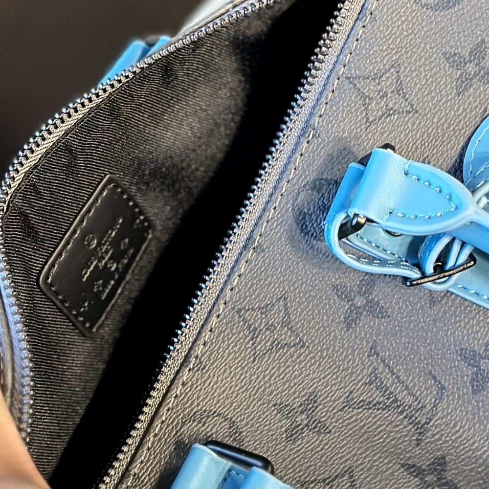LV KEEPALL BANDOULIÈRE 25 MONOGRAM ECLIPSE REVERSE COATED CANVAS TURQUOISE 25CM M11645