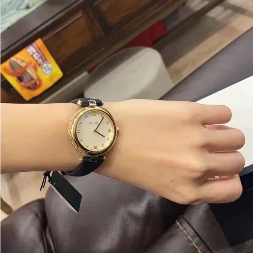 GUCCI DIAMANTISSIMA SWISS QUARTZ WITH BLACK STRAP AND GOLD TONE 27MM YA141404