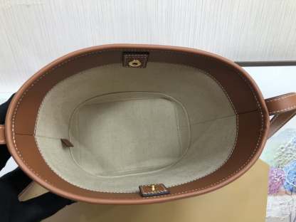 CE CUIR TRIOMPHE IN TEXTILE AND CALFSKIN NATURAL TAN BAG BUCKET
