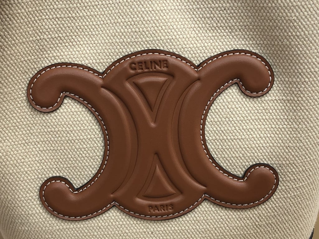 CE CUIR TRIOMPHE IN TEXTILE AND CALFSKIN NATURAL TAN BAG BUCKET