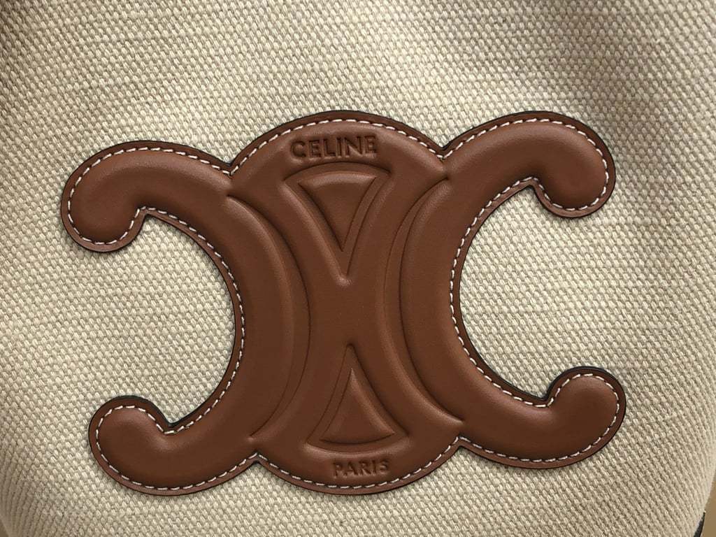 CE CUIR TRIOMPHE IN TEXTILE AND CALFSKIN NATURAL TAN BAG BUCKET