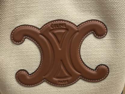 CE CUIR TRIOMPHE IN TEXTILE AND CALFSKIN NATURAL TAN BAG BUCKET