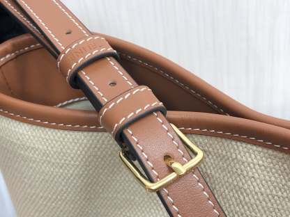 CE CUIR TRIOMPHE IN TEXTILE AND CALFSKIN NATURAL TAN BAG BUCKET