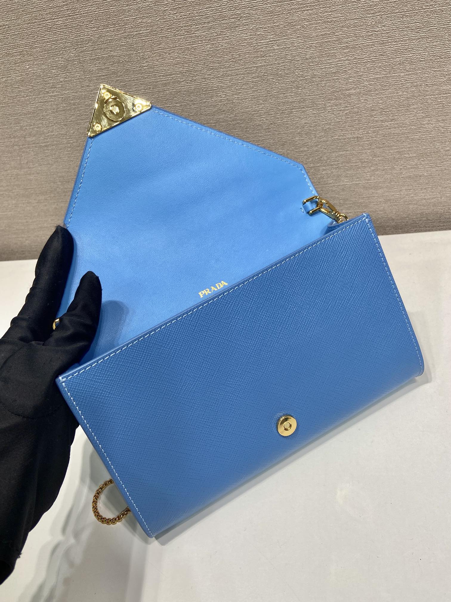 PRA Cross pattern envelope bag blue leather 341158