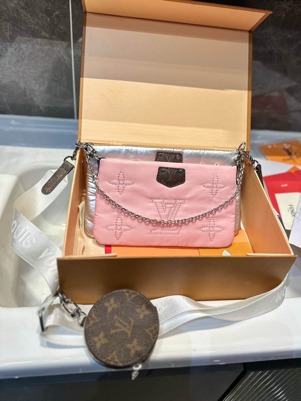 LV MAXI MULTI POCHETTE ACCESSOIRES MONOGRAM PILOW GREY AND PINK 24CM M21056