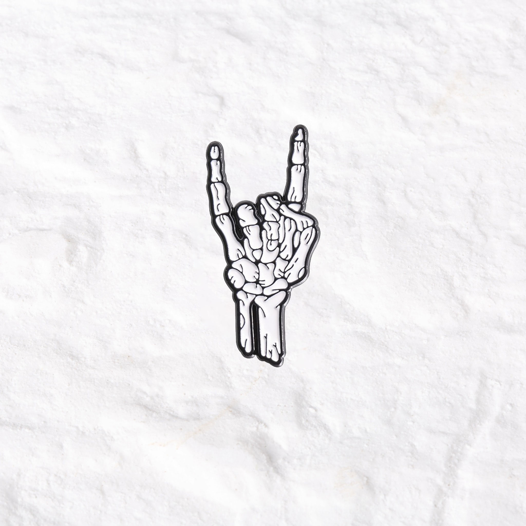 Purplehecate Rock Skeleton Hand Enamel Pin