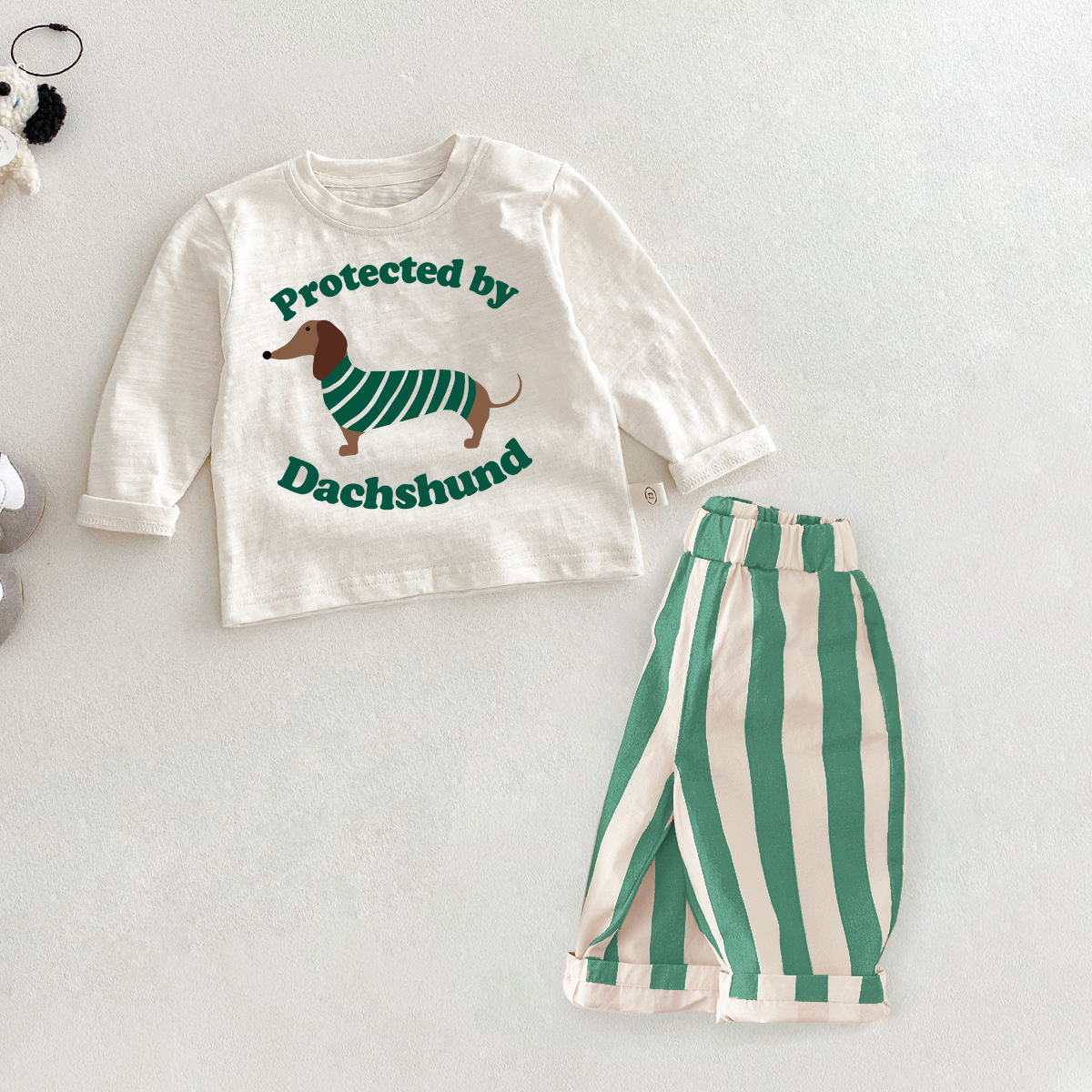 PROTECTED BY DACHSHUND Baby Toddler Slogan 2 Piece Set