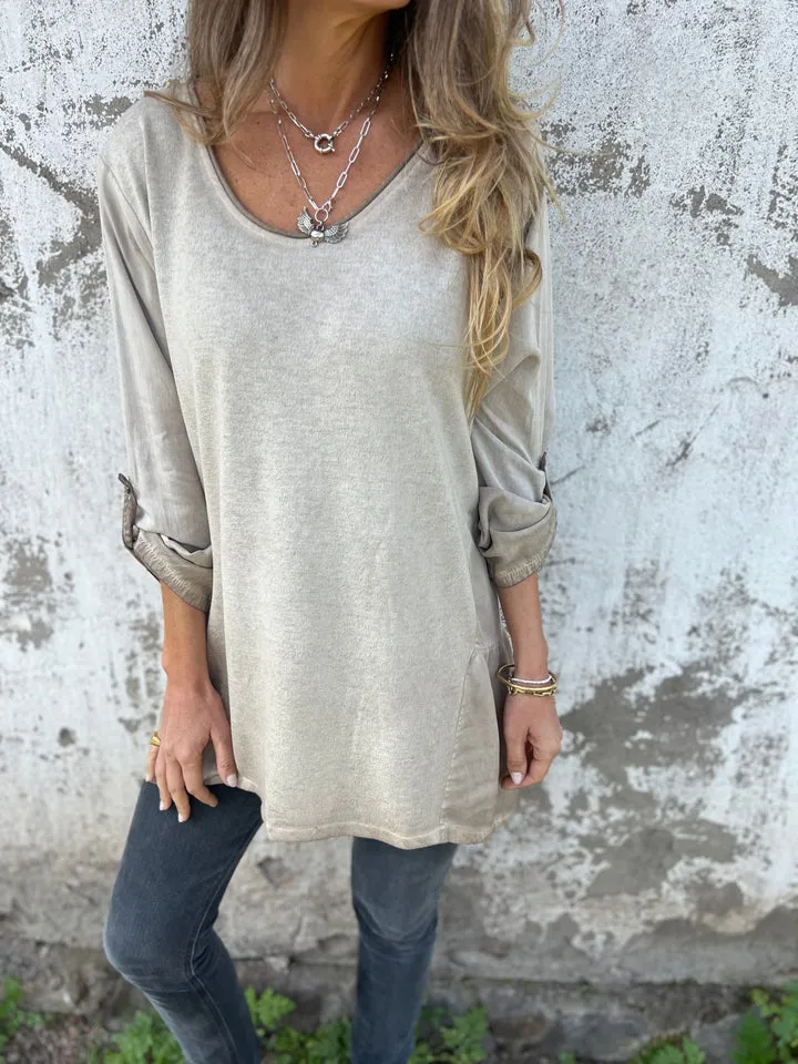 Solid color round neck loose flowing hem long sleeves