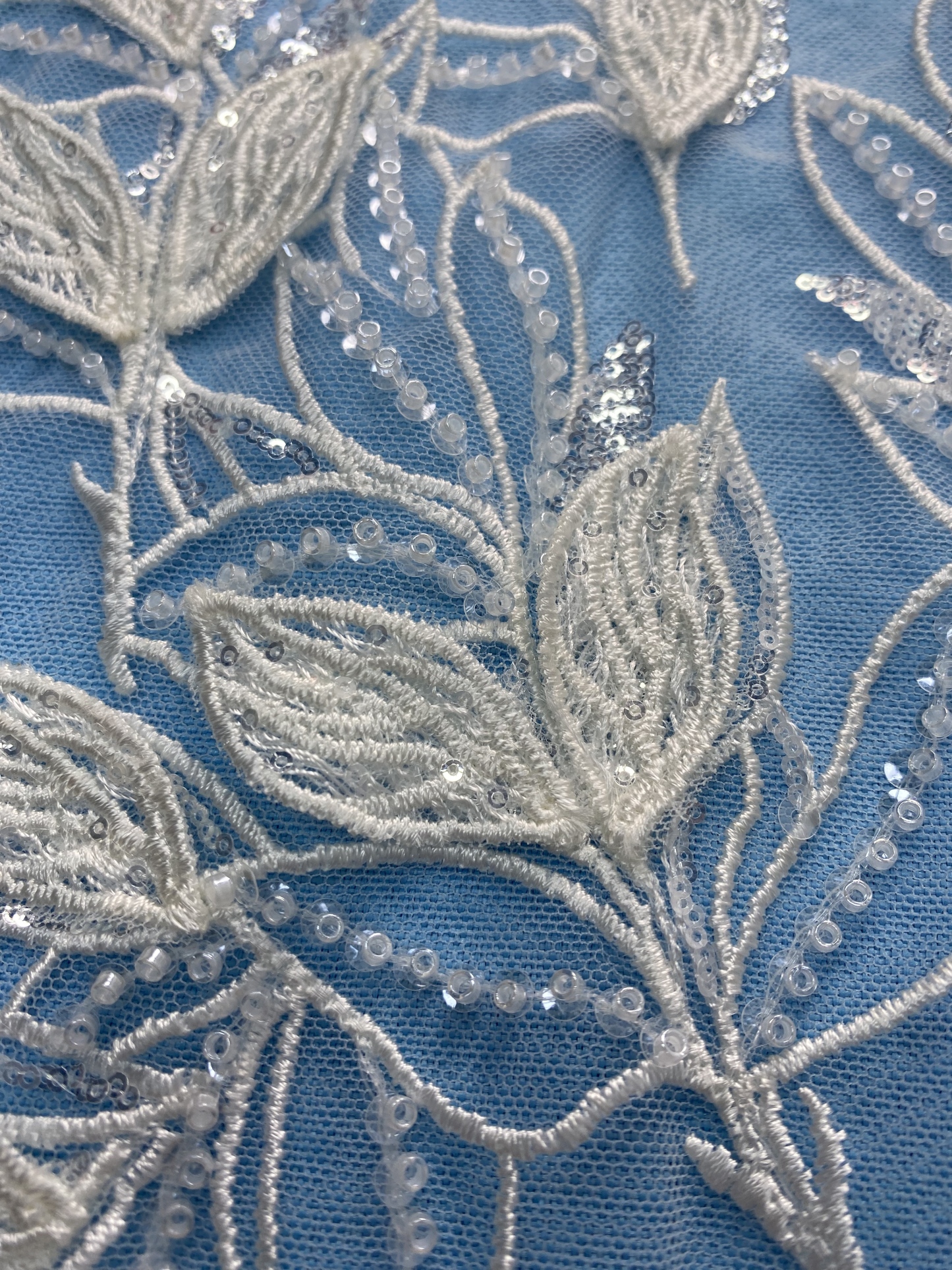 Ivory Tulle Fabric! Adorned with Delicate Leaf Embroidery & Sparkling Sequins. Ideal for Wedding Dresses/Elegant Garments. High-Quality Craftsmanship—Shop This Stunning Material Now!