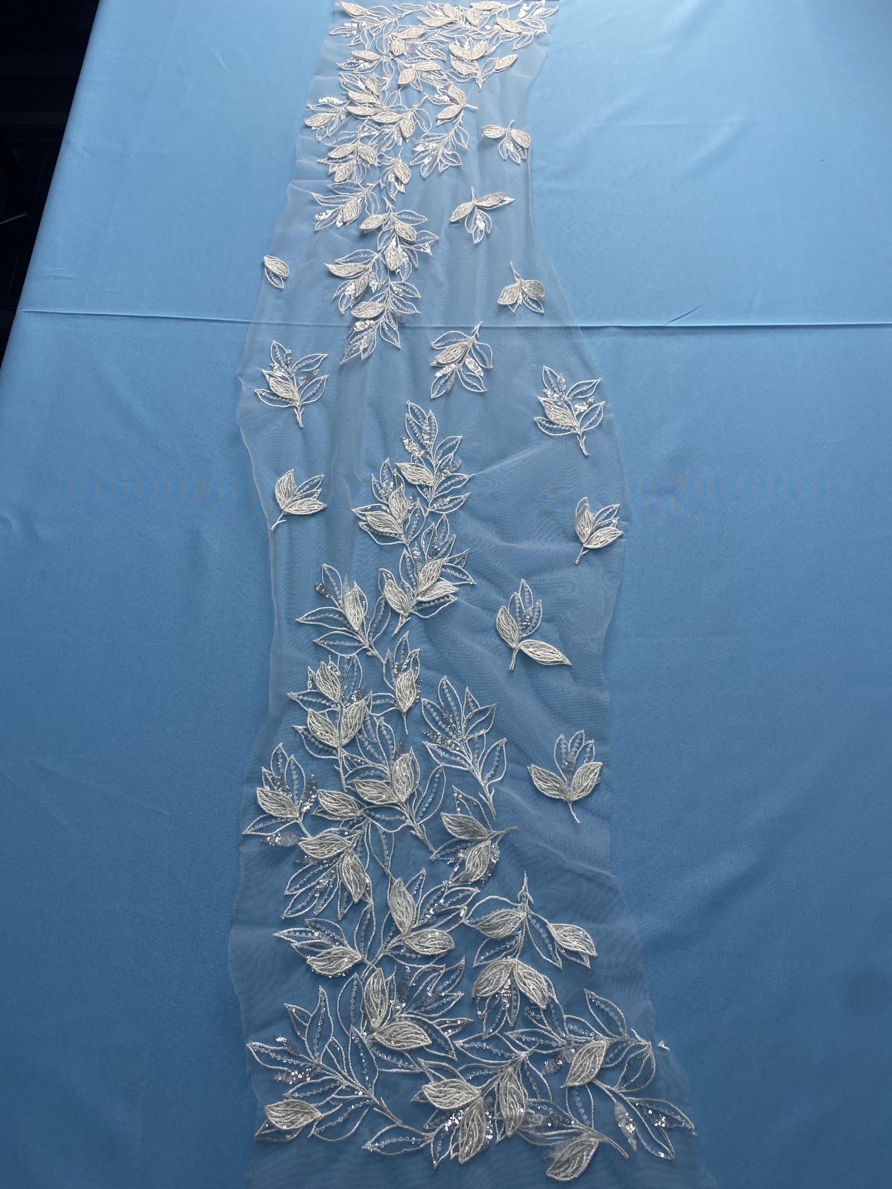 Ivory Tulle Fabric! Adorned with Delicate Leaf Embroidery & Sparkling Sequins. Ideal for Wedding Dresses/Elegant Garments. High-Quality Craftsmanship—Shop This Stunning Material Now!