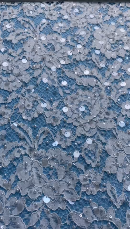Ivory Lace Fabric Embellished with Pearls & Sparkling Sequins! Features Intricate Patterns, Ideal for Wedding Dresses/Evening Wear. Premium Quality—Shop Now!