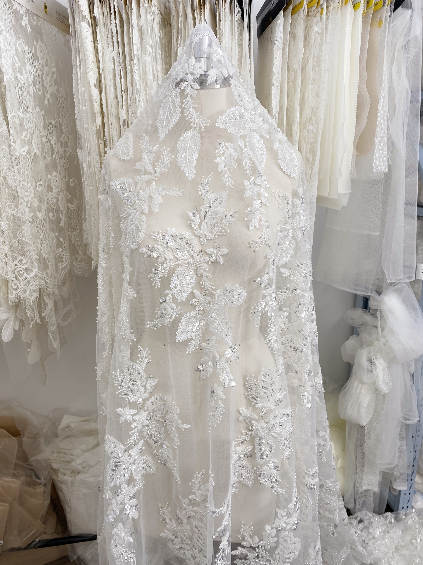 Floral embroidered beaded lace fabric with sequins on soft tulle for wedding dresses, veils, bridal gowns, capes, luxury wedding gown fabric