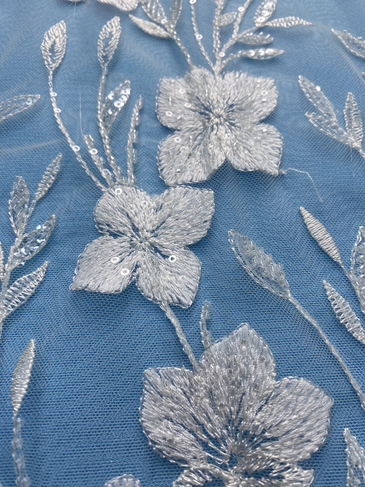 Ivory Fabric with Delicate Floral Embroidery & Sparkling Sequins! Perfect for Wedding Dresses/Evening Wear. Premium Craftsmanship—Grab This Exquisite Material Now!