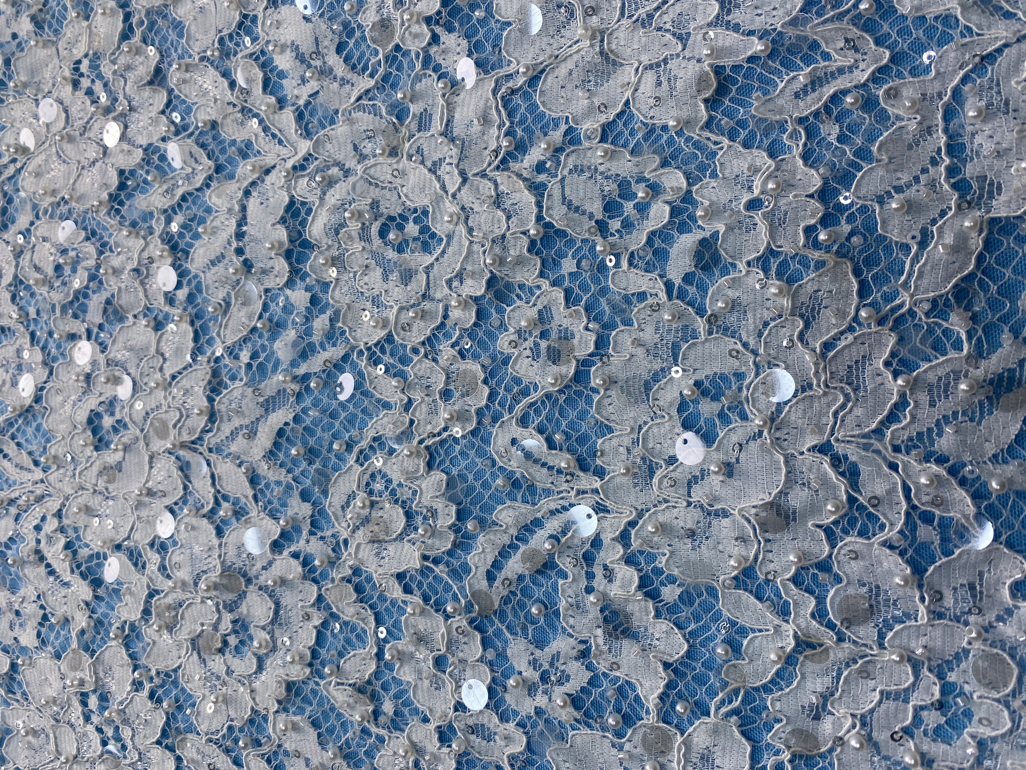 Ivory Lace Fabric Embellished with Pearls & Sparkling Sequins! Features Intricate Patterns, Ideal for Wedding Dresses/Evening Wear. Premium Quality—Shop Now!