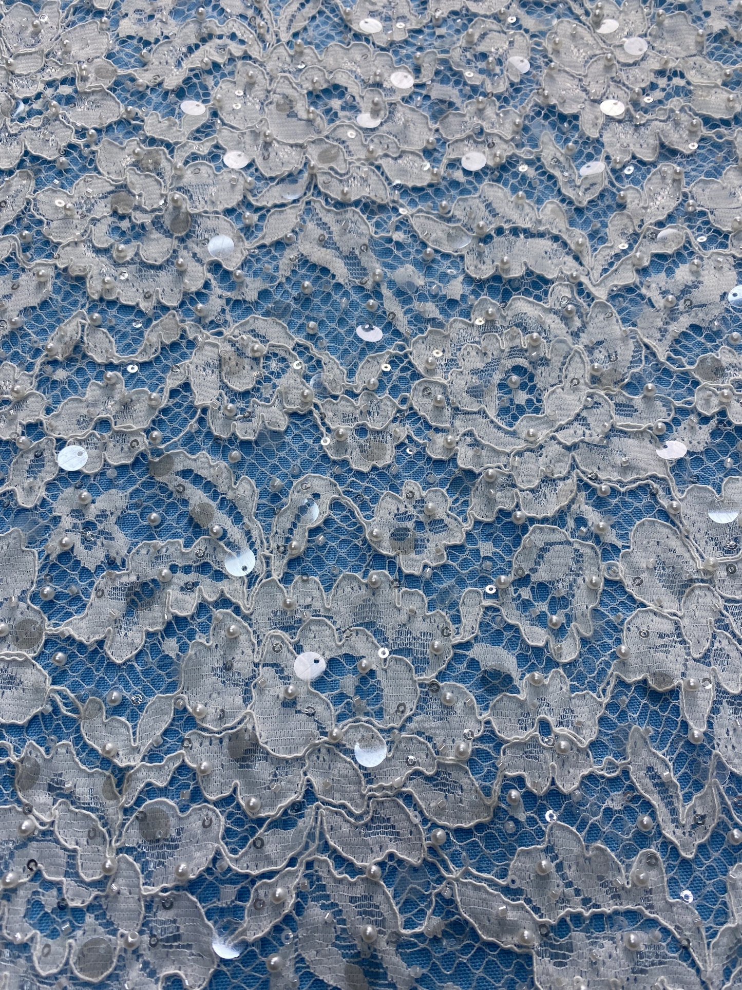 Ivory Lace Fabric Embellished with Pearls & Sparkling Sequins! Features Intricate Patterns, Ideal for Wedding Dresses/Evening Wear. Premium Quality—Shop Now!