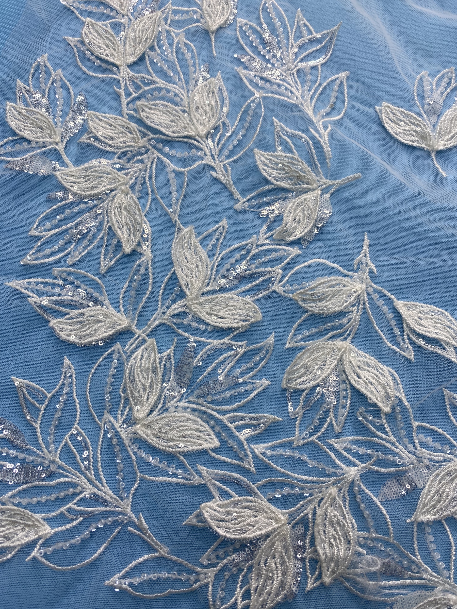 Ivory Tulle Fabric! Adorned with Delicate Leaf Embroidery & Sparkling Sequins. Ideal for Wedding Dresses/Elegant Garments. High-Quality Craftsmanship—Shop This Stunning Material Now!