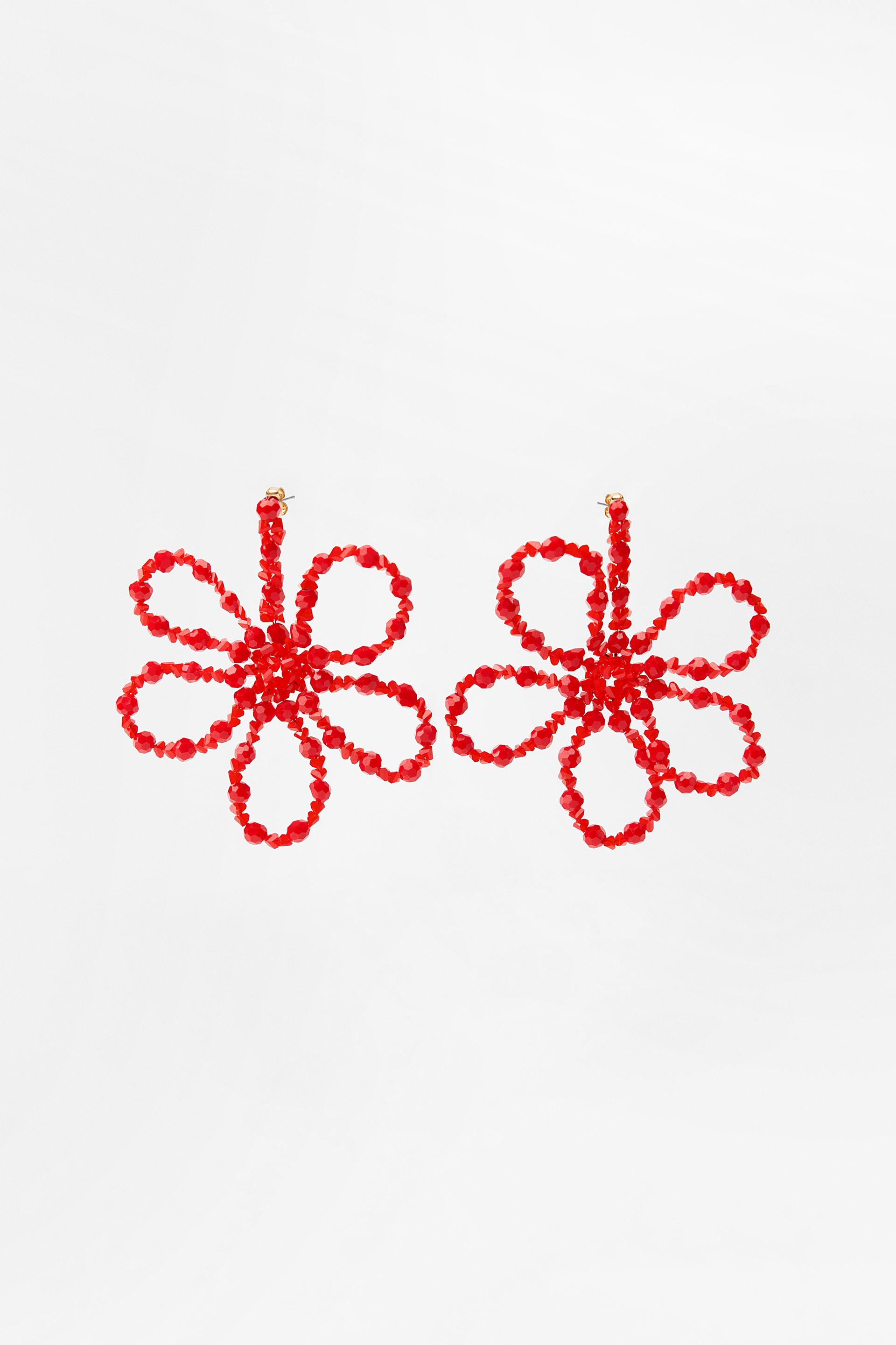 Flower shaped metal drop earrings with colorful bead appliqu. Butterfly closure.