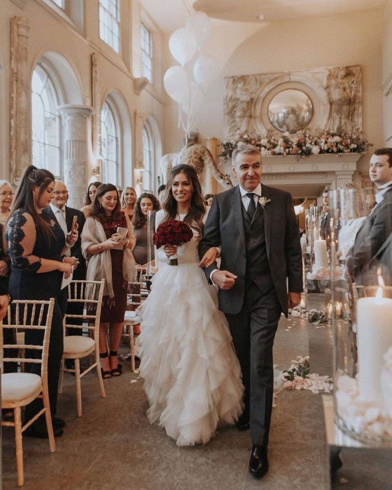 Long sleeves low back white ruffles wedding dress with court train