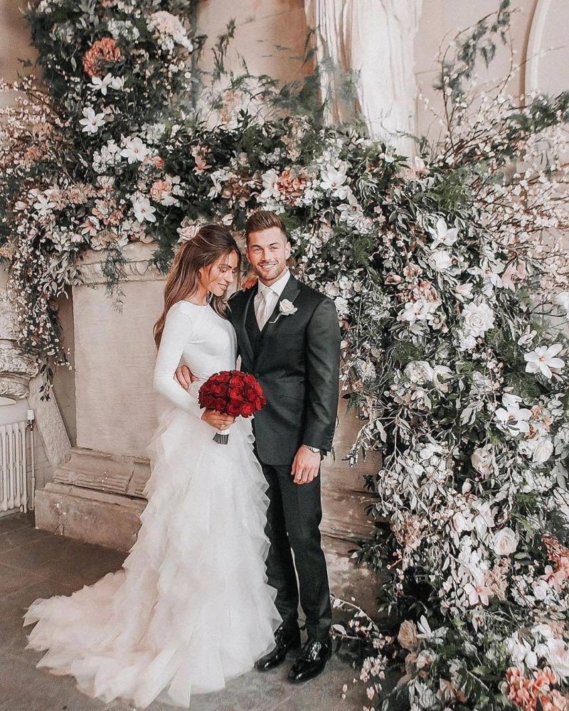Long sleeves low back white ruffles wedding dress with court train