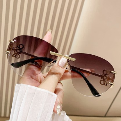 Spykay™ SG60909 Fashion Y2K Rimless Hollow-out Aviator Sunglasses