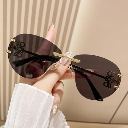 Spykay™ SG60909 Fashion Y2K Rimless Hollow-out Aviator Sunglasses