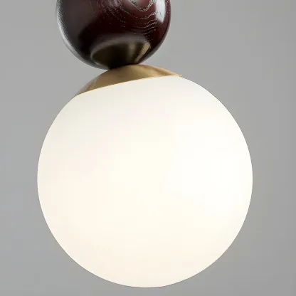 Modern White Glass Globe Pendant Light with Layered Black Bead Image - 5