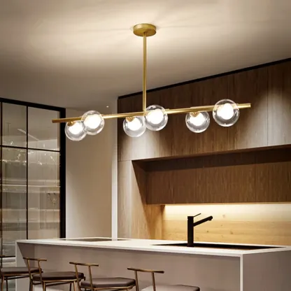 Gold Linear Island Light with 6 Lights Transparent Glass Globe Shades Image - 3