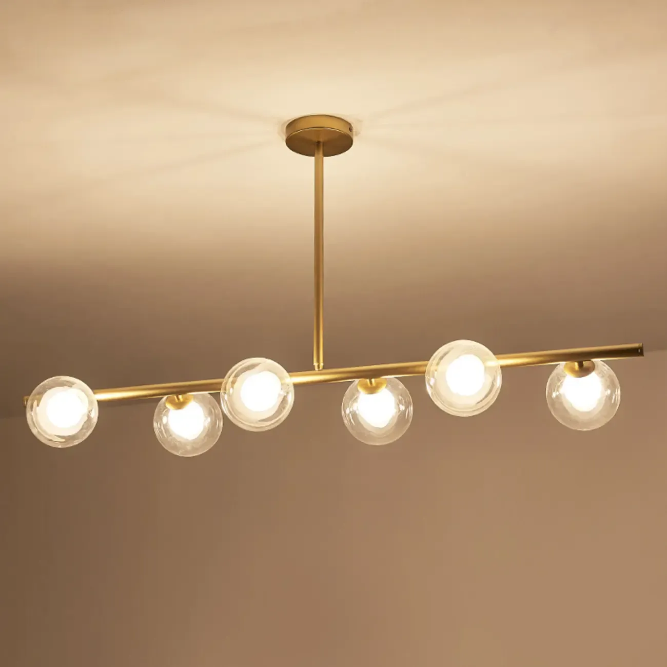 Gold Linear Island Light with 6 Lights Transparent Glass Globe Shades Image - 10