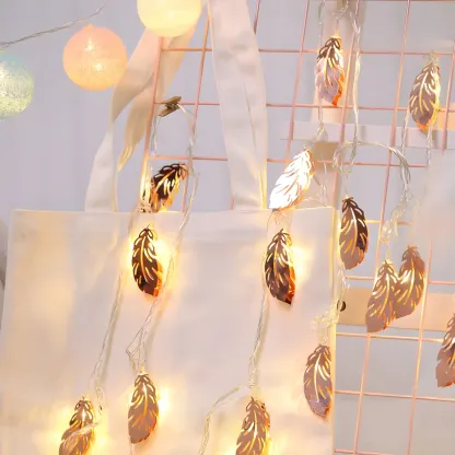 Elegant Rose Gold Metallic Feather Warm String Light Image - 1
