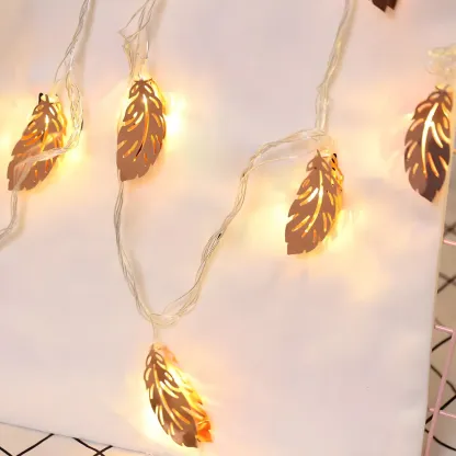 Elegant Rose Gold Metallic Feather Warm String Light Image - 2