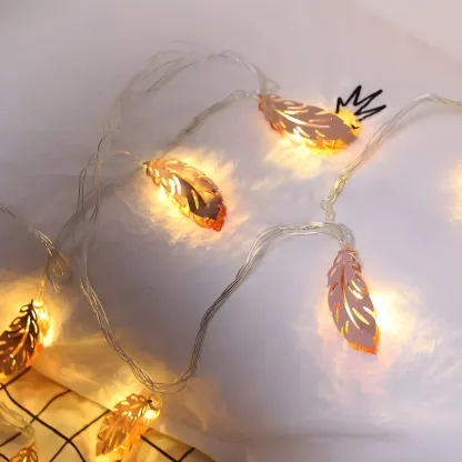 Elegant Rose Gold Metallic Feather Warm String Light Image - 3