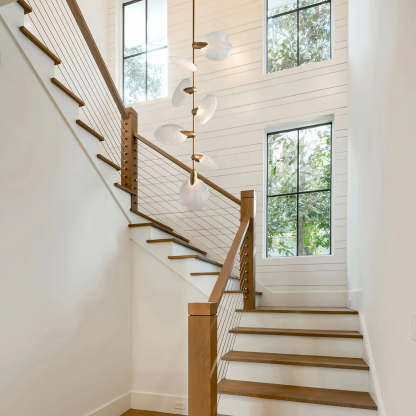 Modern staircase pendant lighting featuring Lyla Pendant in brushed brass