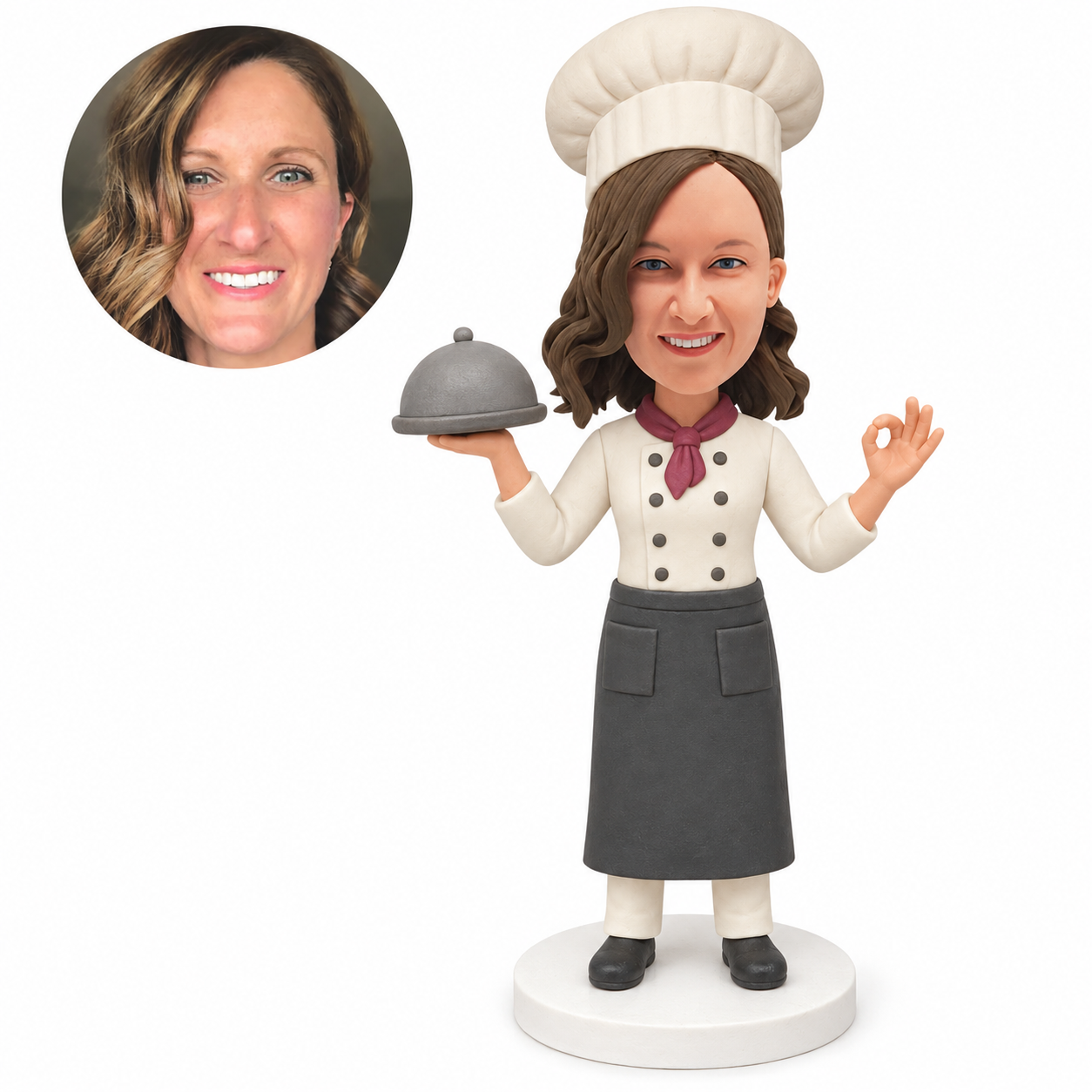custom bobblehead figure female chef holding a cloche and making an OK gesture