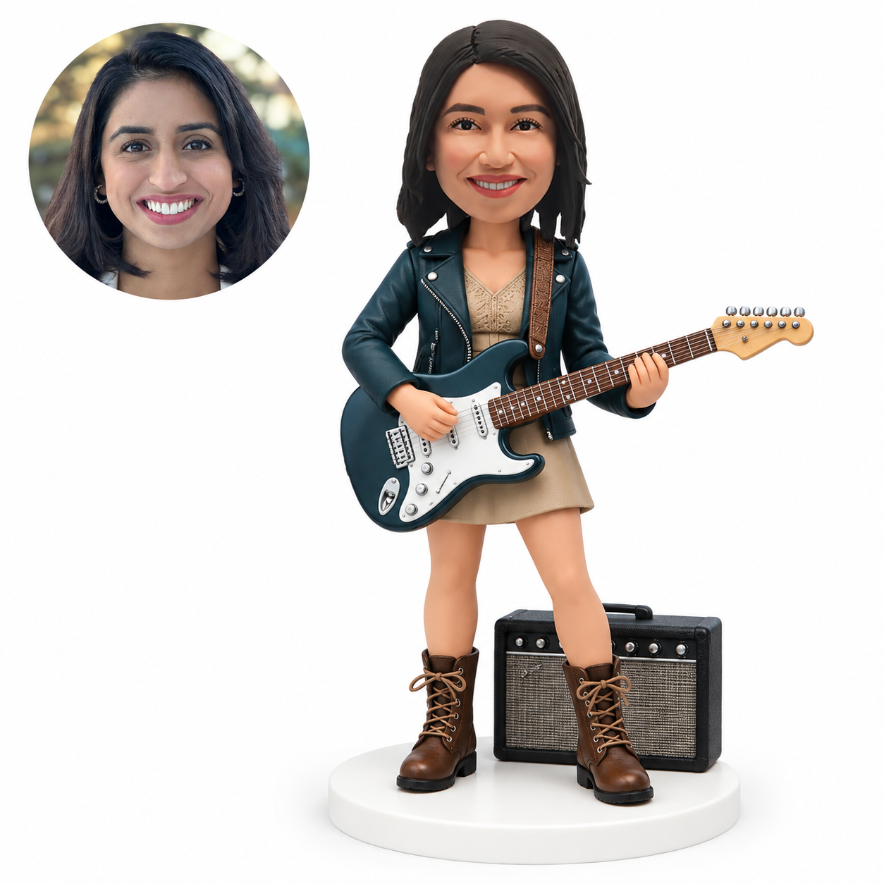 custom bobblehead figure female electric guitarist in a leather jacket beside an amplifier
